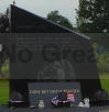 An angel embracing a fallen firefighter is etched on this plaque